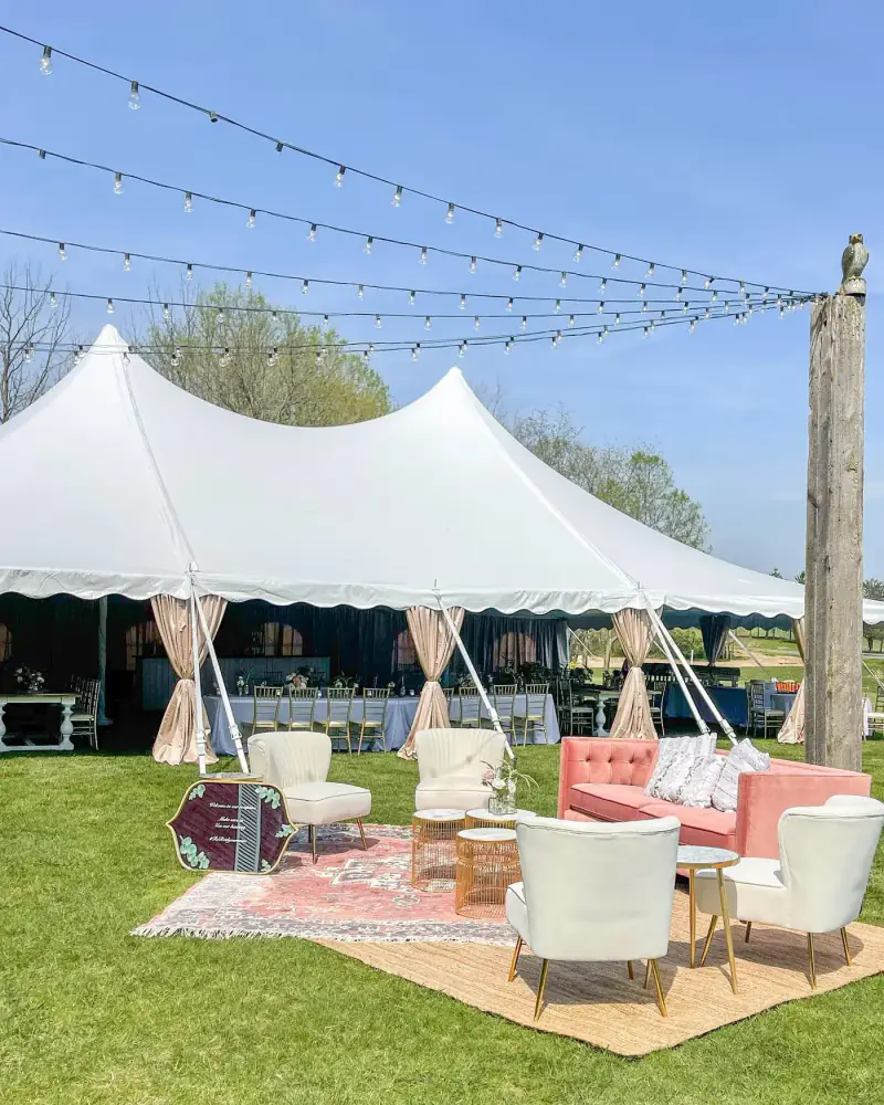 Tent lounge with layered rugs and pillows